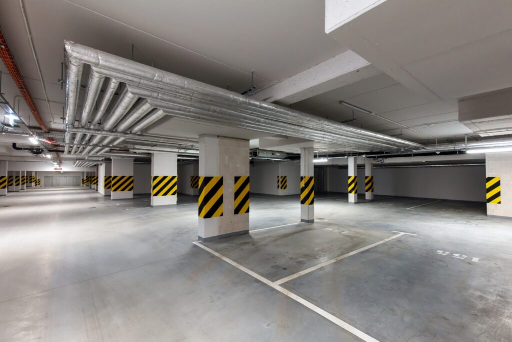 Underground empty parking garage. Modern urban space.